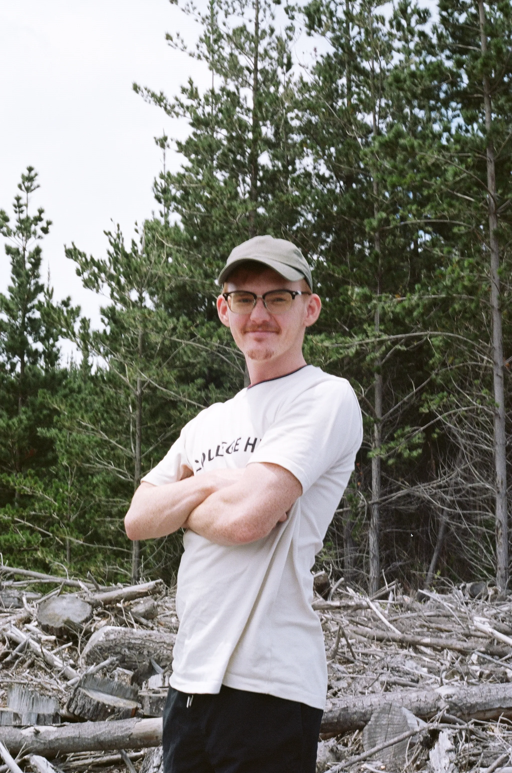 Jack Daun, standing in a cleared pine block, Coromandel